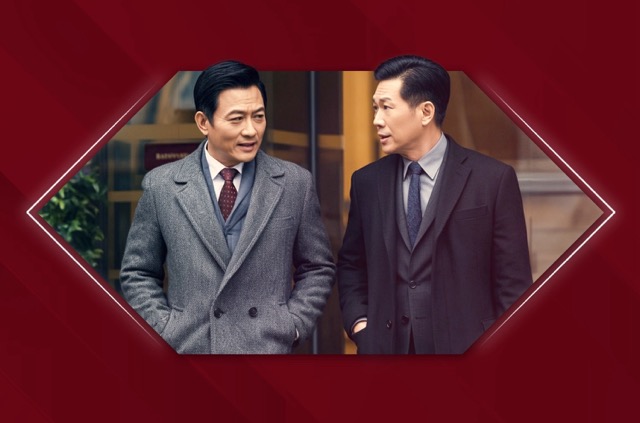 two man in suit having a conversation